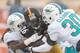 PITTSBURGH, PA - DECEMBER 08: Dannell Ellerbe #59 and Chris Clemons #30 of the Miami Dolphins tackle Le'Veon Bell #26 of the Pittsburgh Steelers in the first quarter at Heinz Field on December 8, 2013 in Pittsburgh, Pennsylvania. Miami won the game 34-28.