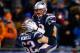 FOXBORO, MA - DECEMBER 08: Tom Brady #12 celebrates with teammate Ryan Wendell #62 of the New England Patriots following a touchdown late in the fourth quarter against the Cleveland Browns during the game at Gillette Stadium on December 8, 2013 in Foxbor
