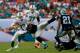 MIAMI GARDENS, FL - NOVEMBER 24: Ryan Tannehill #17 of the Miami Dolphins is tackled by Thomas Davis #58 of the Carolina Panthers at Sun Life Stadium on November 24, 2013 in Miami Gardens, Florida. (Photo by Chris Trotman/Getty Images)