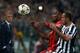 TURIN, ITALY - OCTOBER 02: Didier Drogba of Galatasaray AS (L) and Giorgio Chiellini of Juventus compete for the ball during UEFA Champions League Group B match between Juventus and Galatasaray AS at Juventus Arena on October 2, 2013 in Turin, Italy. (P