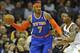 Dec 10, 2013; Cleveland, OH, USA; New York Knicks small forward Carmelo Anthony (7) is guarded by Cleveland Cavaliers small forward Alonzo Gee (33) in the first quarter at Quicken Loans Arena. Mandatory Credit: David Richard-USA TODAY Sports