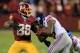 LANDOVER, MD - DECEMBER 01: Free safety Will Hill #25 of the New York Giants strips the ball from wide receiver Pierre Garcon #88 of the Washington Redskins during the closing mintues of the Giants 24-17 win at FedExField on December 1, 2013 in Landover,