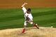 John Axford throws a pitch during Game Four of the World Series against Boston.