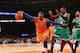NEW YORK, NY - DECEMBER 08: Carmelo Anthony #7 of the New York Knicks dribbles the ball against the Boston Celtics at Madison Square Garden on December 8, 2013 in New York City. NOTE TO USER: User expressly acknowledges and agrees that, by downloading an