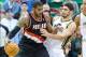 Dec 9, 2013; Salt Lake City, UT, USA; Portland Trail Blazers power forward LaMarcus Aldridge (12) is defended by Utah Jazz center Enes Kanter (0) during the second half at EnergySolutions Arena. Portland won 105-94. Mandatory Credit: Russ Isabella-USA TOD