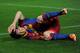 SEVILLE, SPAIN - MARCH 13: Lionel Messi of Barcelona reacts after colliding with goalkeeper Javier Varas of Sevilla during the la Liga match between Sevilla and Barcelona at Estadio Ramon Sanchez Pizjuan on March 13, 2011 in Seville, Spain. (Photo by Ja