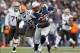 Ridley's backup, LeGarrette Blount, keeps the ball secure with both hands ready to cover it at the first sign of contact