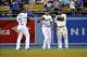 August 30, 2013; Los Angeles, CA, USA; Los Angeles Dodgers left fielder Carl Crawford (25), center fielder Andre Ethier (16) and right fielder Yasiel Puig (66) celebrate the 9-2 victory against the San Diego Padres at Dodger Stadium. Mandatory Credit: Gar