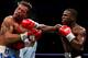 ATLANTIC CITY, NJ - JUNE 25: Arturo Gatti (L) is hit by Floyd Mayweather Jr. (R) during their WBC Super Lightweight Championship fight at Boardwalk Hall on June 25, 2005 in Atlantic City, New Jersey. Mayweather won the fight after Gatti's corner stopped