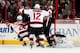 RALEIGH, NC - NOVEMBER 29: Damien Brunner #12 of the New Jersey Devils reacts as a shot by teammate Andrei Loktionov #21 finds its way past Cam Ward #30 of the Carolina Hurricanes of the New Jersey Devils during their NHL game at PNC Arena on November 29,