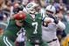 Dec 8, 2013; East Rutherford, NJ, USA; New York Jets quarterback Geno Smith (7) throws a pass while under pressure from Oakland Raiders defensive tackle Vance Walker (98) during the first half at MetLife Stadium. Mandatory Credit: Ed Mulholland-USA TODAY