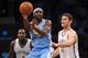 NEW YORK, NY - DECEMBER 03: Ty Lawson #3 of the Denver Nuggets looks for a pass with pressure from Brook Lopez #11 of the Brooklyn Nets during the second half at Barclays Center on December 3, 2013 in the Brooklyn borough of New York City. The Nuggets de
