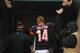 CINCINNATI, OH - DECEMBER 08: Andy Dalton #14 of the Cincinnati Bengals walks off the field victorious against the Indianapolis Colts at Paul Brown Stadium on December 8, 2013 in Cincinnati, Ohio. The Bengals defeated the Colts 42-28. (Photo by John Gr