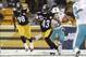 Dec 8, 2013; Pittsburgh, PA, USA; Pittsburgh Steelers strong safety Troy Polamalu (43) runs with the ball after a missed Miami Dolphins field goal during the second quarter at Heinz Field. The Miami Dolphins won 34-28. Mandatory Credit: Charles LeClaire-U