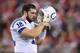 GLENDALE, AZ - NOVEMBER 24: Quarterback Andrew Luck #12 of the Indianapolis Colts reacts as he walks off the field during the NFL game against the Arizona Cardinals at the University of Phoenix Stadium on November 24, 2013 in Glendale, Arizona. The Cardi