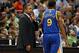 Nov 6, 2013; Minneapolis, MN, USA; Golden State Warriors head coach Mark Jackson talks to shooting guard Andre Iguodala (9) in the second half against the Minnesota Timberwolves at Target Center. The Warriors won 106-93. Mandatory Credit: Jesse Johnson-US