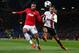 MANCHESTER, ENGLAND - DECEMBER 10: Robin van Persie of Manchester United competes with Darijo Srna of Shakhtar Donetsk during the UEFA Champions League Group A match between Manchester United and Shakhtar Donetsk at Old Trafford on December 10, 2013 in M