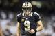 NEW ORLEANS, LA - DECEMBER 8: Drew Brees #9 of the New Orleans Saints jogs onto the field during a game against the Carolina Panthers at Mercedes-Benz Superdome on December 8, 2013 in New Orleans, Louisiana. The Saints defeated the Panthers 31-13. (Pho