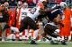 FOXBORO, MA - DECEMBER 08: Rob Gronkowski #87 of the New England Patriots catches a pass before being hit by T.J. Ward #43 and D'Qwell Jackson #52 of the Cleveland Browns in the third quarter during the game at Gillette Stadium on December 8, 2013 in Fo