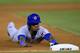 OAKLAND, CA - JULY 03: Julio Borbon #20 of the Chicago Cubs dives into third base with a triple in the seventh inning against the Oakland Athletics at O.co Coliseum on July 3, 2013 in Oakland, California. (Photo by Thearon W. Henderson/Getty Images)