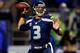 SEATTLE, WA - DECEMBER 02: Quarterback Russell Wilson #3 of the Seattle Seahawks passes against the New Orleans Saints during a game at CenturyLink Field on December 2, 2013 in Seattle, Washington. (Photo by Jonathan Ferrey/Getty Images)