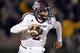Nov 30, 2013; Columbia, MO, USA; Texas A&M Aggies quarterback Johnny Manziel (2) scrambles to the outside against the Missouri Tigers during the first half at Faurot Field. Mandatory Credit: Peter G. Aiken-USA TODAY Sports