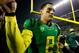 EUGENE, OR - NOVEMBER 29: Quarterback Marcus Mariota #8 of the Oregon Ducks walks off the field after a 36-35 victory against the Oregon State Beavers during the 117th playing of the Civil War on November 29, 2013 at the Autzen Stadium in Eugene, Oregon.