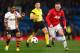 MANCHESTER, ENGLAND - DECEMBER 10: Wayne Rooney of Manchester United competes with Douglas Costa of Shakhtar Donetsk during the UEFA Champions League Group A match between Manchester United and Shakhtar Donetsk at Old Trafford on December 10, 2013 in Man