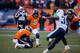 DENVER, CO - DECEMBER 8: Place kicker Matt Prater #5 of the Denver Broncos kicks a 64-yard field goal for a new NFL record on a hold by Britton Colquitt #4 during the second quarter against the Tennessee Titans at Sports Authority Field Field at Mile Hig