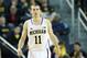 ANN ARBOR, MI - DECEMBER 07: Nik Stauskas #11 of the University of Michigan Wolverines looks to the bench during the second half of the game against Houston Baptist Huskies at the Crisler Center on December 7, 2013 in Ann Arbor, Michigan. Michigan defeat