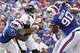 Sep 29, 2013; Orchard Park, NY, USA; Buffalo Bills outside linebacker Manny Lawson (91) sacks Baltimore Ravens quarterback Joe Flacco (5) as defensive tackle Alan Branch (90) rushes during the second half at Ralph Wilson Stadium. The Bills won 23-20. Mand
