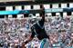 CHARLOTTE, NC - DECEMBER 01: Cam Newton #1 of the Carolina Panthers celebrates after running for a touchdown against the Tampa Bay Buccaneers during their game at Bank of America Stadium on December 1, 2013 in Charlotte, North Carolina. (Photo by Street