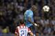 Mangala beats Atleti's Leo Baptistao to a header