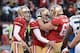 December 8, 2013; San Francisco, CA, USA; San Francisco 49ers kicker Phil Dawson (9) is congratulated by punter Andy Lee (4, left) and guard Daniel Kilgore (67) after making the game-winning field goal against the Seattle Seahawks during the fourth quarte
