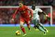 LIVERPOOL, ENGLAND - DECEMBER 07: Joe Allen of Liverpool competes with Mohamed Diame of West Ham United during the Barclays Premier League match between Liverpool and West Ham United at Anfield on December 7, 2013 in Liverpool, England. (Photo by Clive