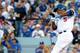 LOS ANGELES, CA - OCTOBER 15: Juan Uribe #5 of the Los Angeles Dodgers breaks his bat as he lines out to second base in the second inning against the St. Louis Cardinals in Game Four of the National League Championship Series at Dodger Stadium on October