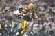18 Nov 1996: Linebacker Broderick Thomas of the Dallas Cowboys goes after Green Bay Packers quarterback Brett Favre during a game at Texas Stadium in Irving, Texas. The Cowboys won the game, 21-6. Mandatory Credit: Brian Bahr /Allsport