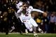 COLUMBIA, MO - NOVEMBER 30: Quarterback Johnny Manziel #2 of the Texas A&M Aggies scrambles as defensive lineman Markus Golden #33 of the Missouri Tigers persues during the game on November 30, 2013 in Columbia, Missouri. (Photo by Jamie Squire/Getty Im
