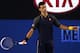 MELBOURNE, AUSTRALIA - JANUARY 20: Novak Djokovic of Serbia reacts in his fourth round match against Stanislas Wawrinka of Switzerland during day seven of the 2013 Australian Open at Melbourne Park on January 20, 2013 in Melbourne, Australia. (Photo by