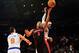 Feb 13, 2013; New York, NY, USA; Toronto Raptors point guard Kyle Lowry (3) puts up a shot over the defense of New York Knicks small forward Carmelo Anthony (7) and point guard Pablo Prigioni (9) during the first half at Madison Square Garden. Mandatory
