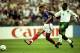 18 Jun 1998: Thierry Henry of France scores despite the attention of Abdullah Zubromawi of Saudi Arabia during the World Cup group C game at the Stade de France in St Denis, France. Henry scored two as France won 4-0. \ Mandatory Credit: Clive Brunskill/