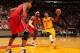 MIAMI, FL - FEBRUARY 24: Kyrie Irving #2 of the Cleveland Cavaliers drives against LeBron James #6 of the Miami Heat during a game between the Cleveland Cavaliers and the Miami Heat on February 24, 2013 at American Airlines Arena in Miami, Florida. NOTE