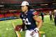 Dec 7, 2013; Atlanta, GA, USA; Auburn Tigers running back Tre Mason (21) runs with his MVP trophy after the 2013 SEC Championship game against the Missouri Tigers at Georgia Dome. The Auburn Tigers defeated the Missouri Tigers 59-42. Mandatory Credit: Kev