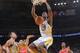OAKLAND, CA - DECEMBER 13: Harrison Barnes #40 of the Golden State Warriors dunks against the Houston Rockets on December 13, 2013 at Oracle Arena in Oakland, California. NOTE TO USER: User expressly acknowledges and agrees that, by downloading and or usi