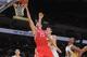 OAKLAND, CA - DECEMBER 13: Chandler Parsons #25 of the Houston Rockets shoots against the Golden State Warriors on December 13, 2013 at Oracle Arena in Oakland, California. NOTE TO USER: User expressly acknowledges and agrees that, by downloading and or u