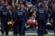 MANCHESTER, ENGLAND - DECEMBER 14: Laurent Koscielny of Arsenal is stretchered off during the Barclays Premier League match between Manchester City and Arsenal at Etihad Stadium on December 14, 2013 in Manchester, England. (Photo by Clive Brunskill/Gett