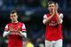 MANCHESTER, ENGLAND - DECEMBER 14: Jack Wilshere of Arsenal and Per Mertesacker of Arsenal walk back down towards tunnel during the Barclays Premier League match between Manchester City and Arsenal at Etihad Stadium on December 14, 2013 in Manchester, En