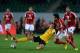 AGADIR, MOROCCO - DECEMBER 14: Zhi Zheng of Guangzhou is challenged by Trezeget of Al-Ahly during the FIFA Club World Cup quarterfinal match between Guangzhou Evergrande FC and Al-Ahly SC at Agadir Stadium on December 14, 2013 in Agadir, Morocco. (Photo