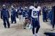 Dec 8, 2013; Denver, CO, USA; Tennessee Titans running back Chris Johnson (28) reacts on the sidelines late in the fourth quarter against the Denver Broncos at Sports Authority Field at Mile High. The Broncos defeated the Titans 51-28. Mandatory Credit: R