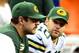 Nov 28, 2013; Detroit, MI, USA; Green Bay Packers quarterback Aaron Rodgers (left) sits on the bench next to quarterback Matt Flynn (10) during the fourth quarter of a NFL football game against the Detroit Lions on Thanksgiving at Ford Field. Mandatory Cr